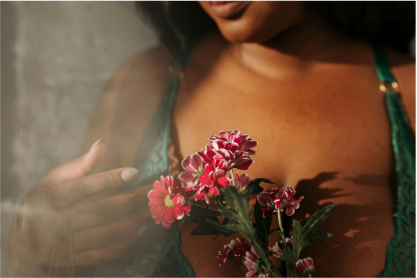 Woman holding pink flowers wearing Lace Bra Lingerie