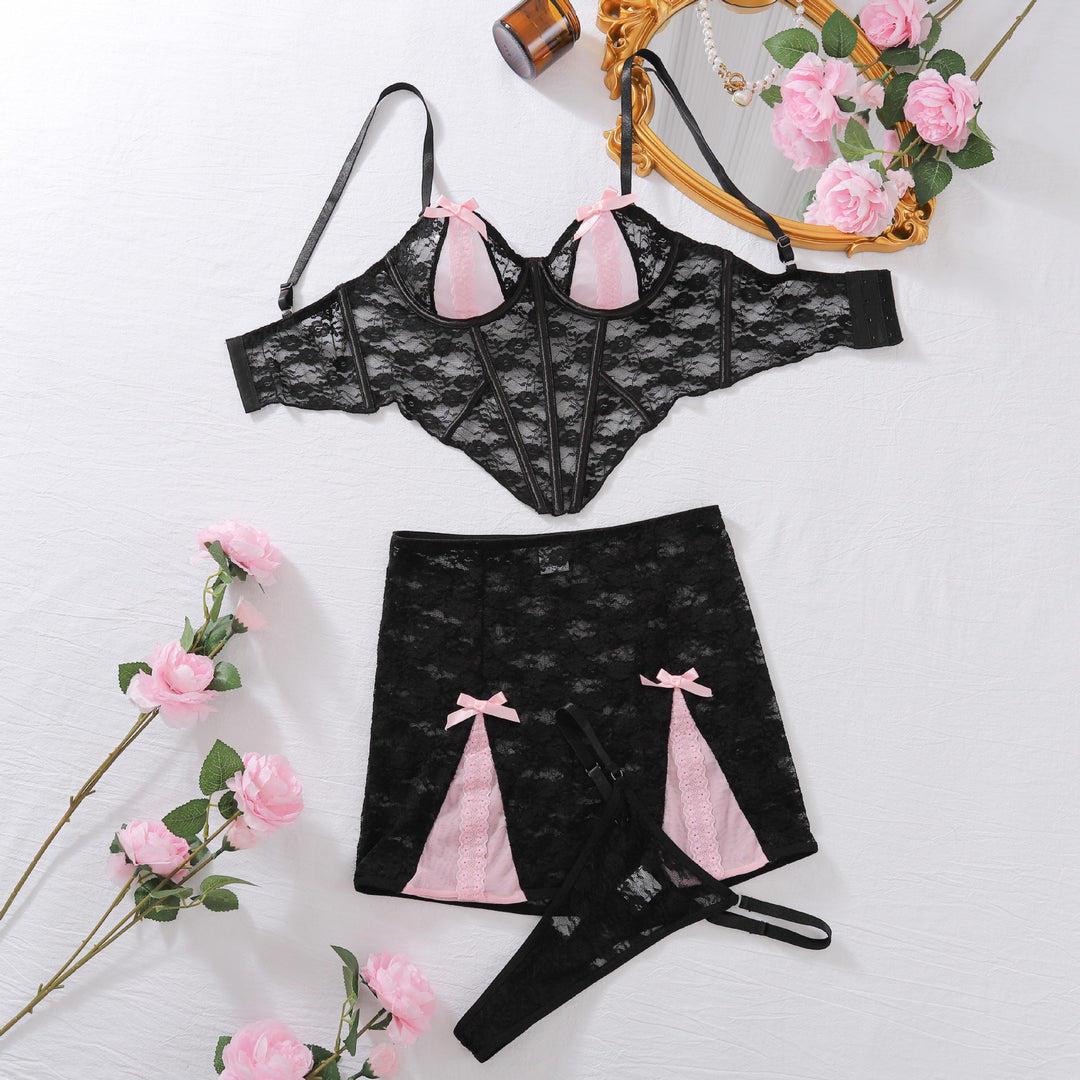 Detailed floral lace texture with pink contrast panels and satin bow finish on Sugar & Spice lingerie set